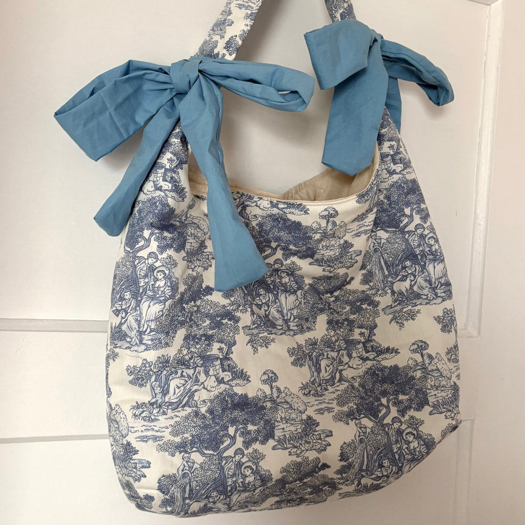 Handmade white and blue porcelain coquette farm print padded tote bag with blue bows