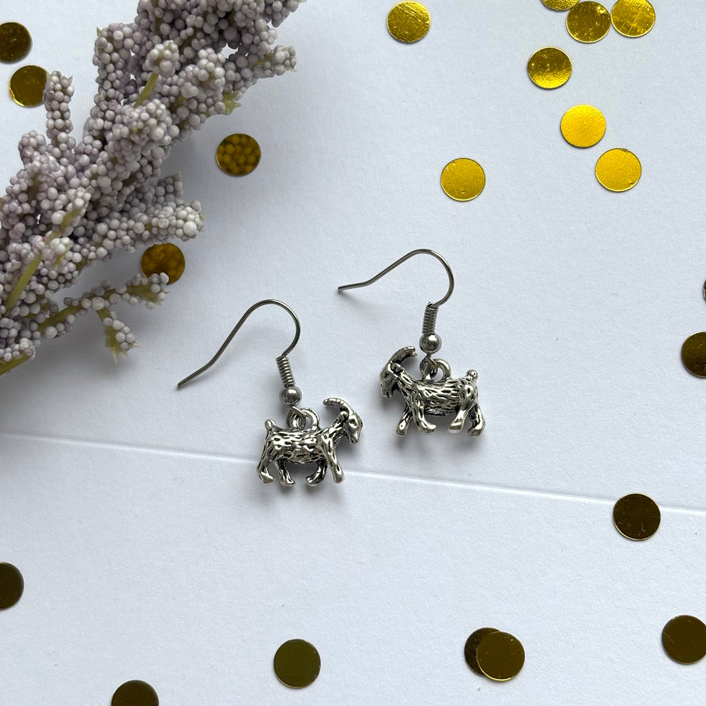 Silver goat earrings on hypoallergenic hooks
