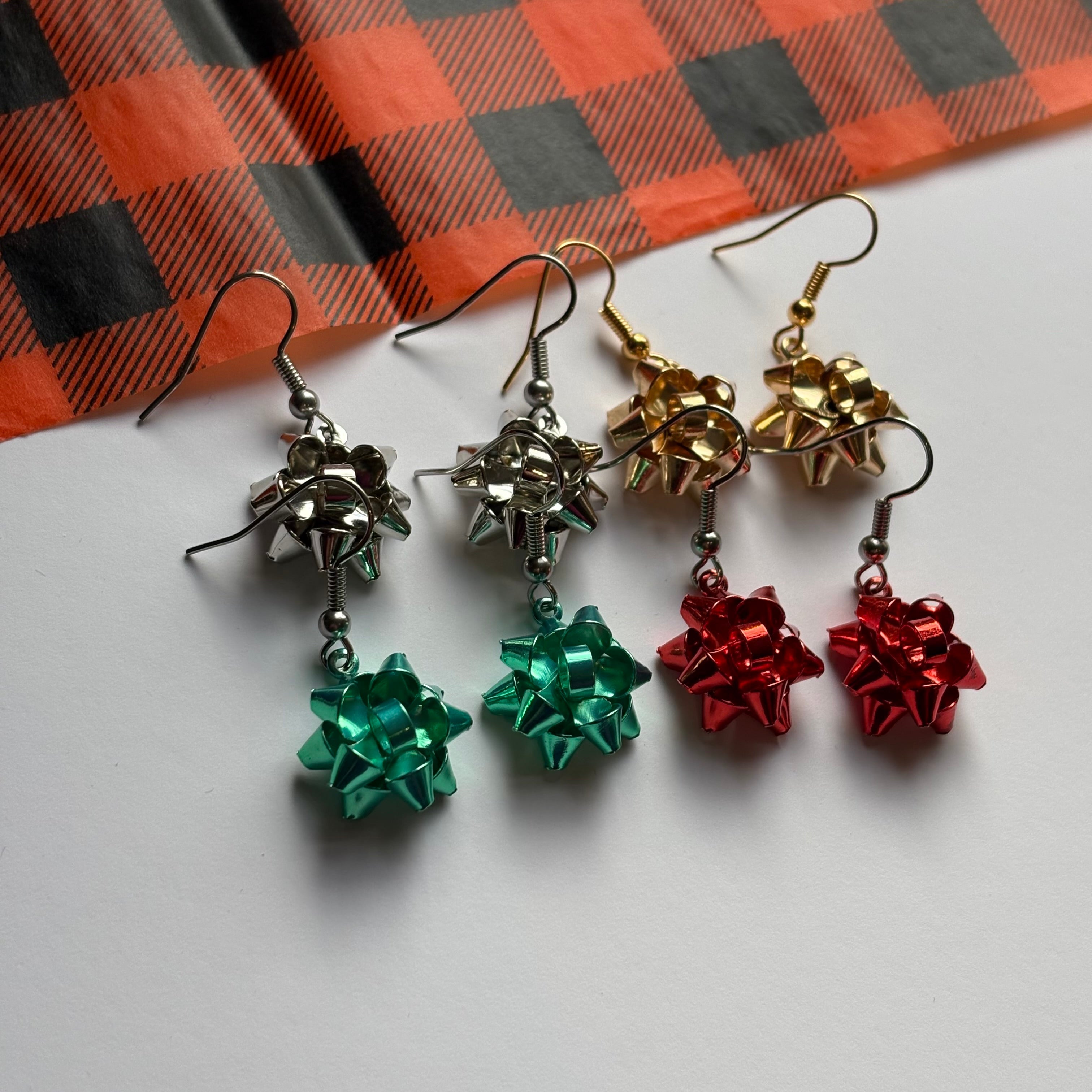 Colourful dangle Christmas fun quirky present bow earrings