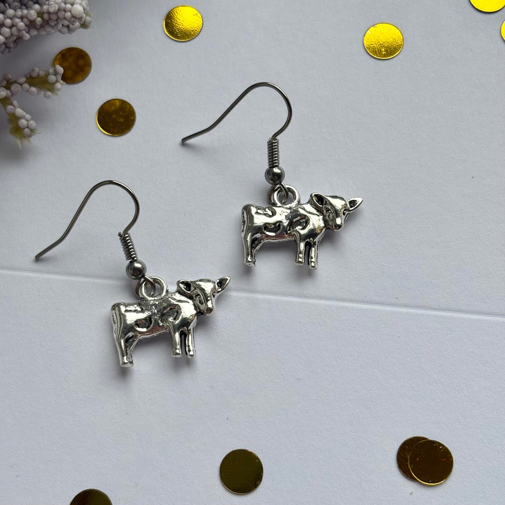 Silver cow earrings on hypoallergenic hooks