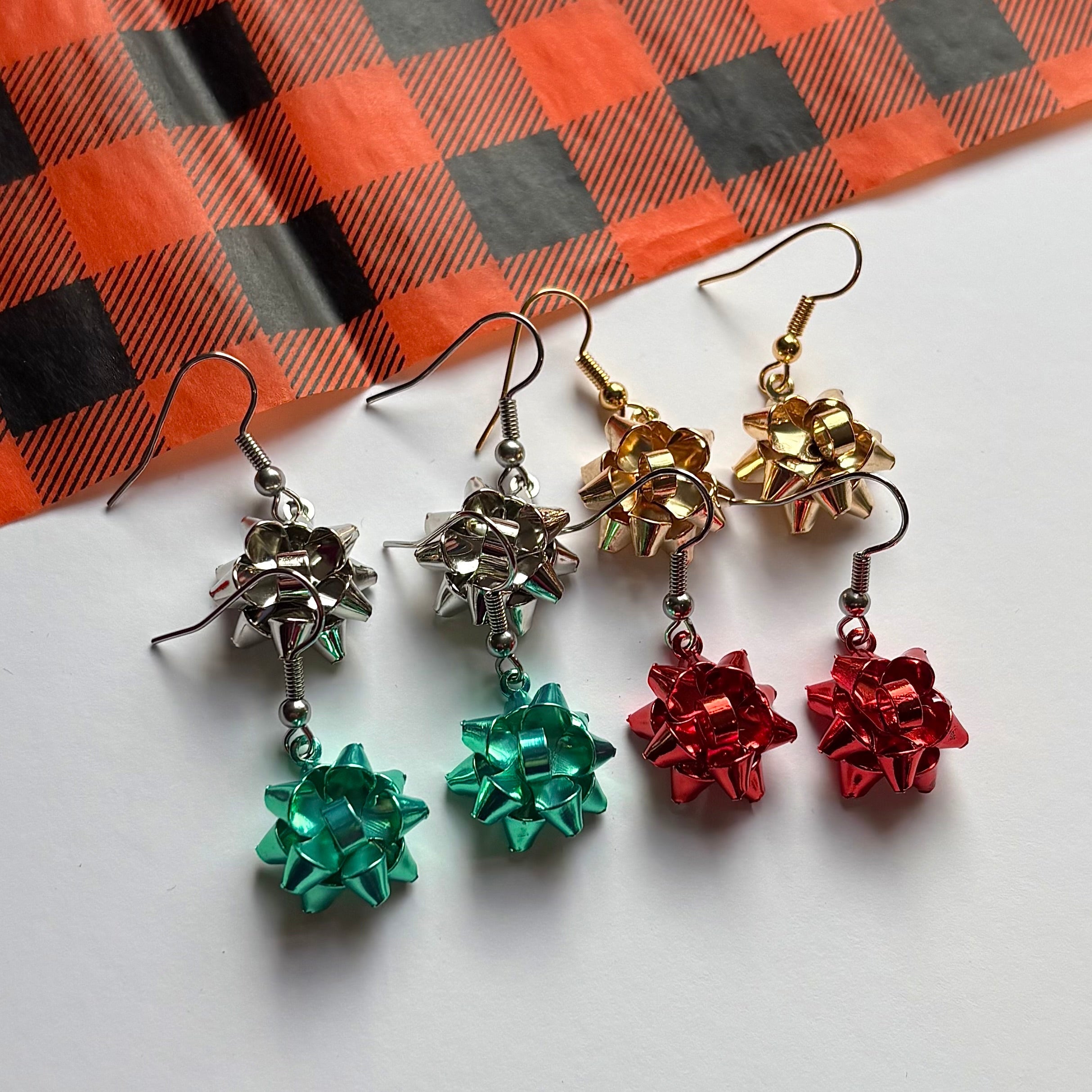 Colourful dangle Christmas fun quirky present bow earrings