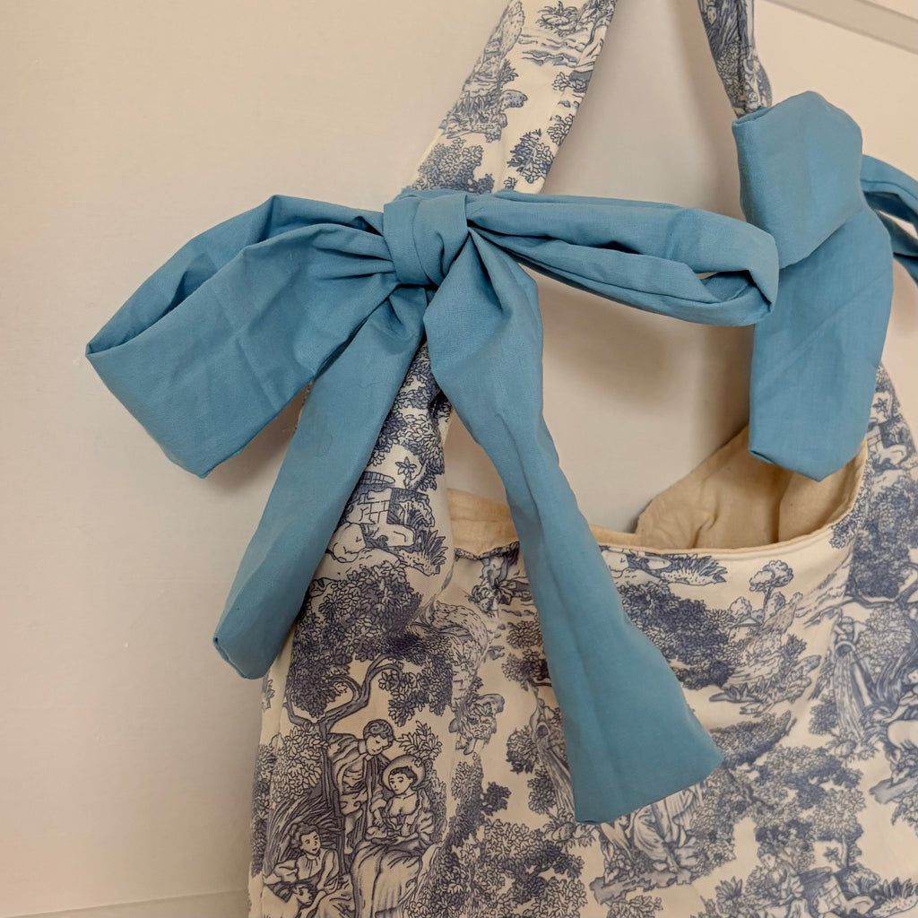 Handmade white and blue porcelain coquette farm print padded tote bag with blue bows