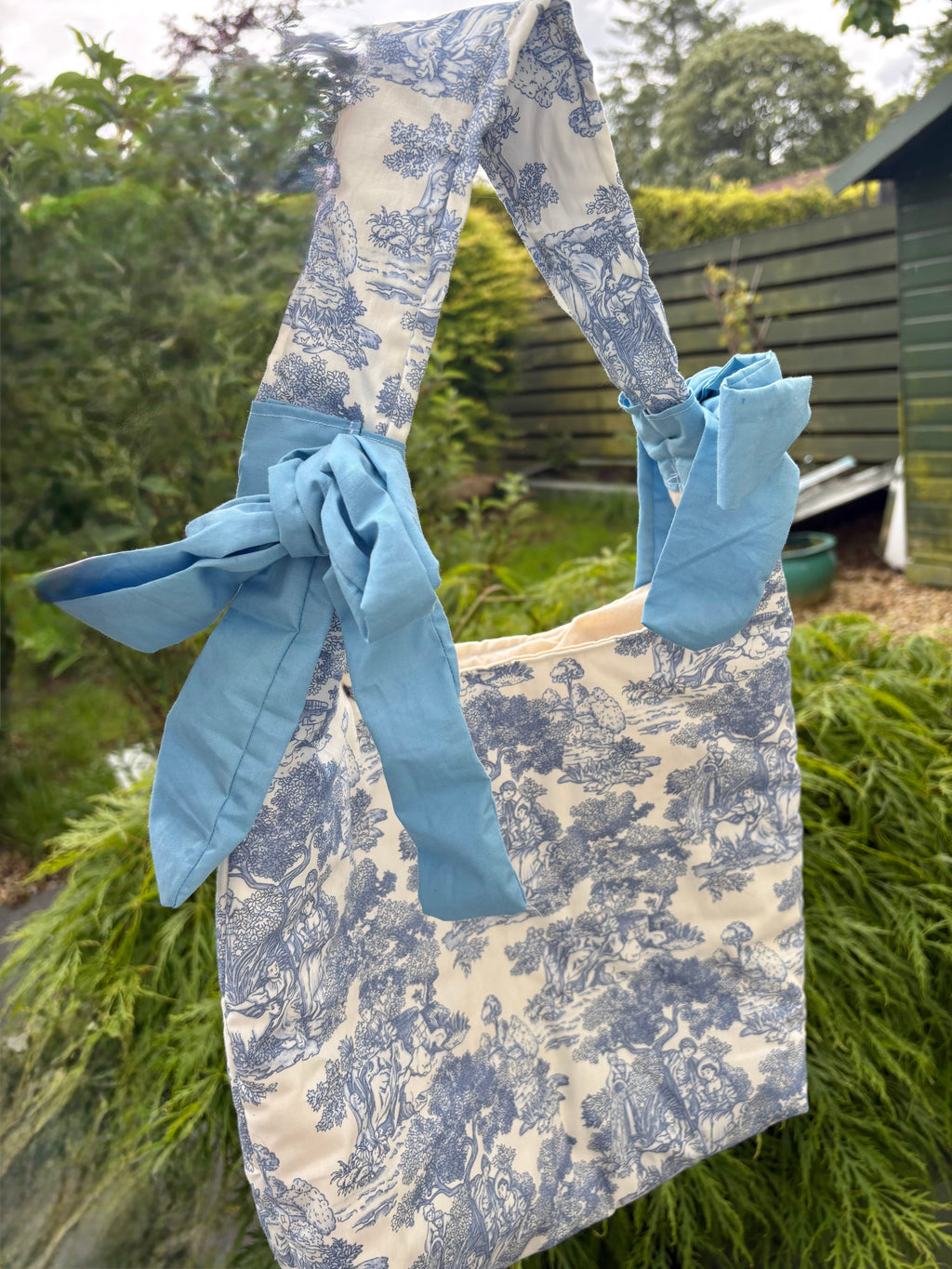 Handmade white and blue porcelain coquette farm print padded tote bag with blue bows
