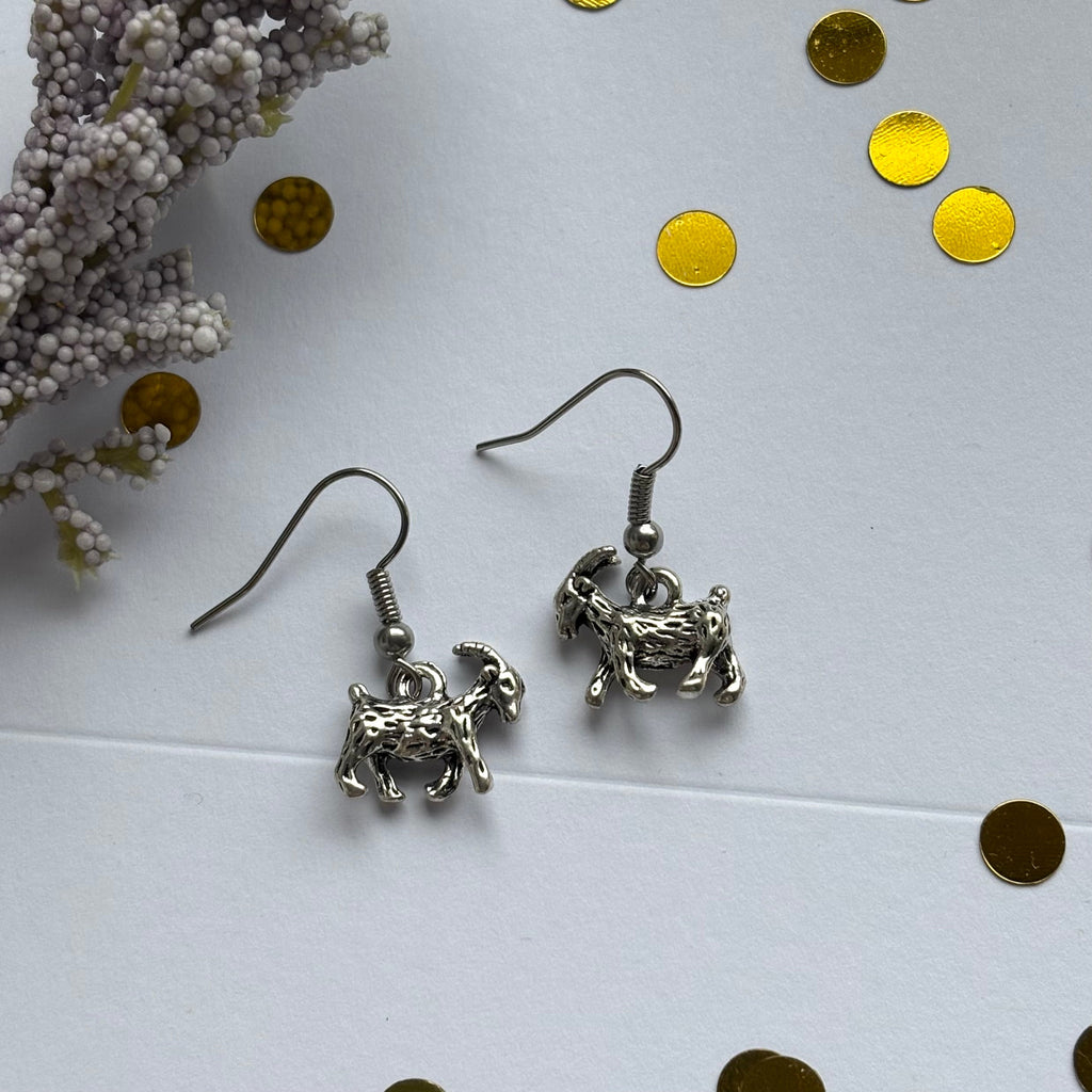 Silver goat earrings on hypoallergenic hooks