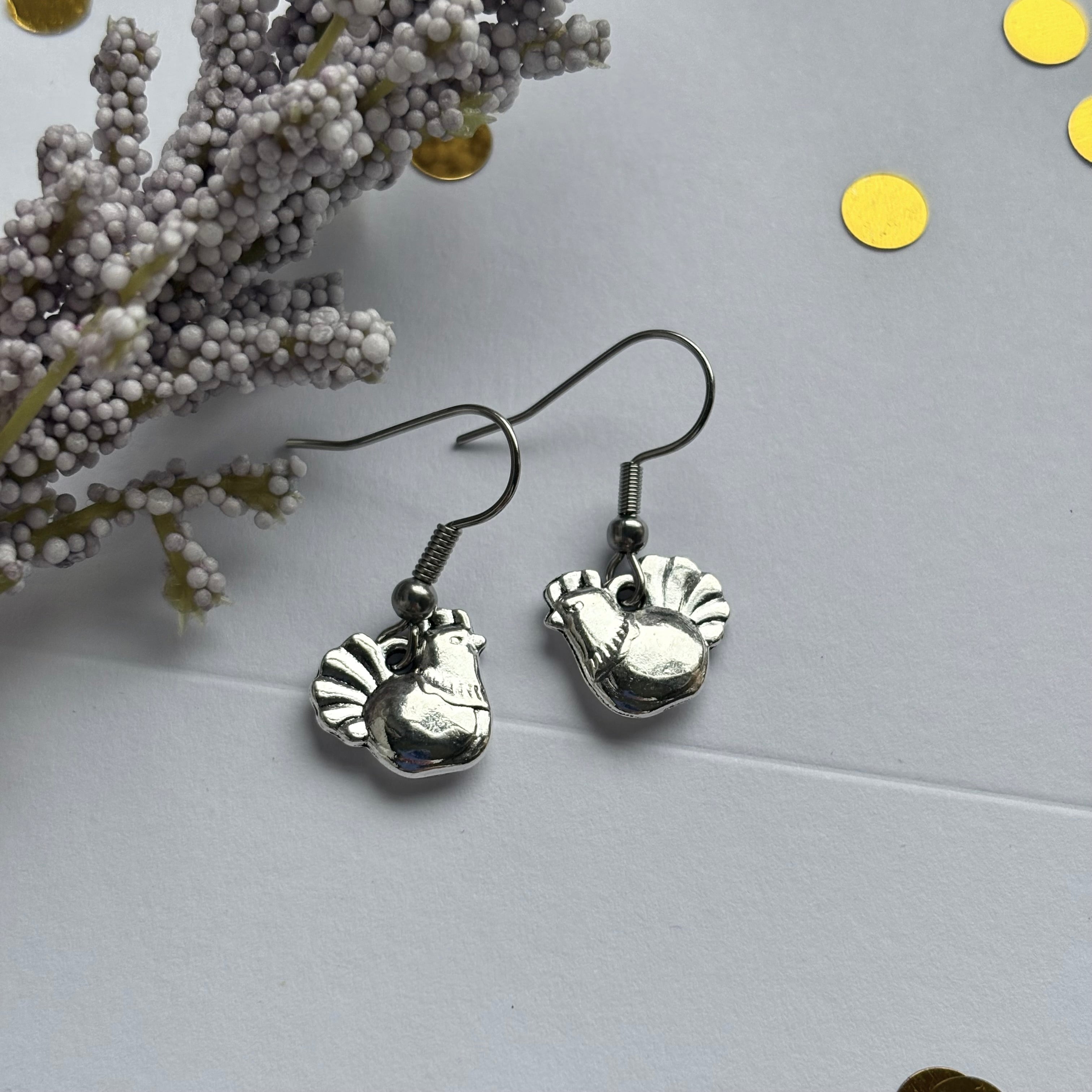 Silver chicken earrings on hypoallergenic hooks