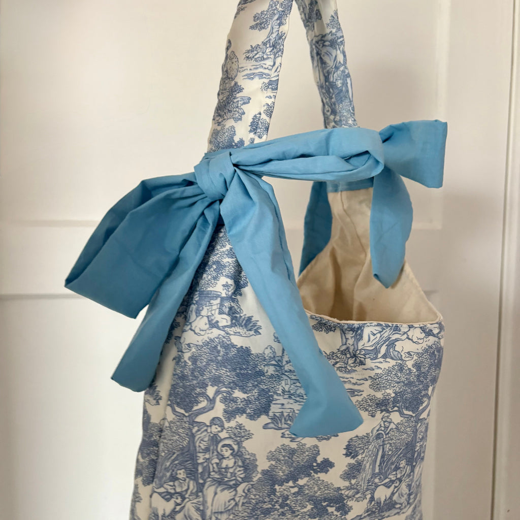 Handmade white and blue porcelain coquette farm print padded tote bag with blue bows