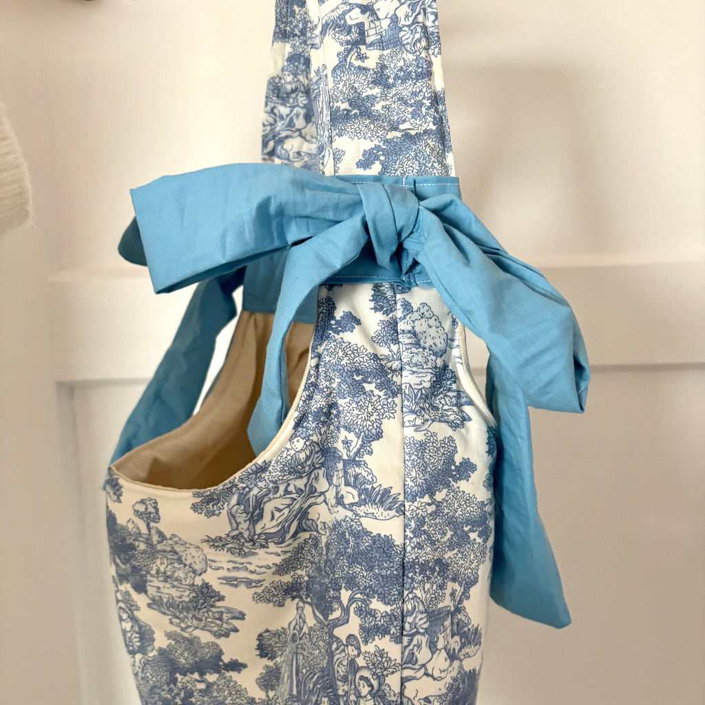 Handmade white and blue porcelain coquette farm print padded tote bag with blue bows
