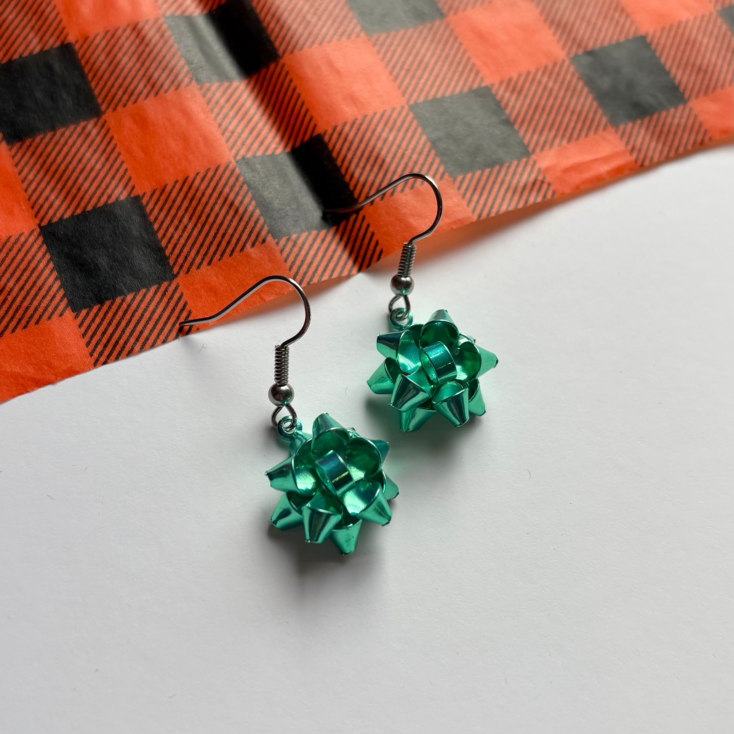 Colourful dangle Christmas fun quirky present bow earrings