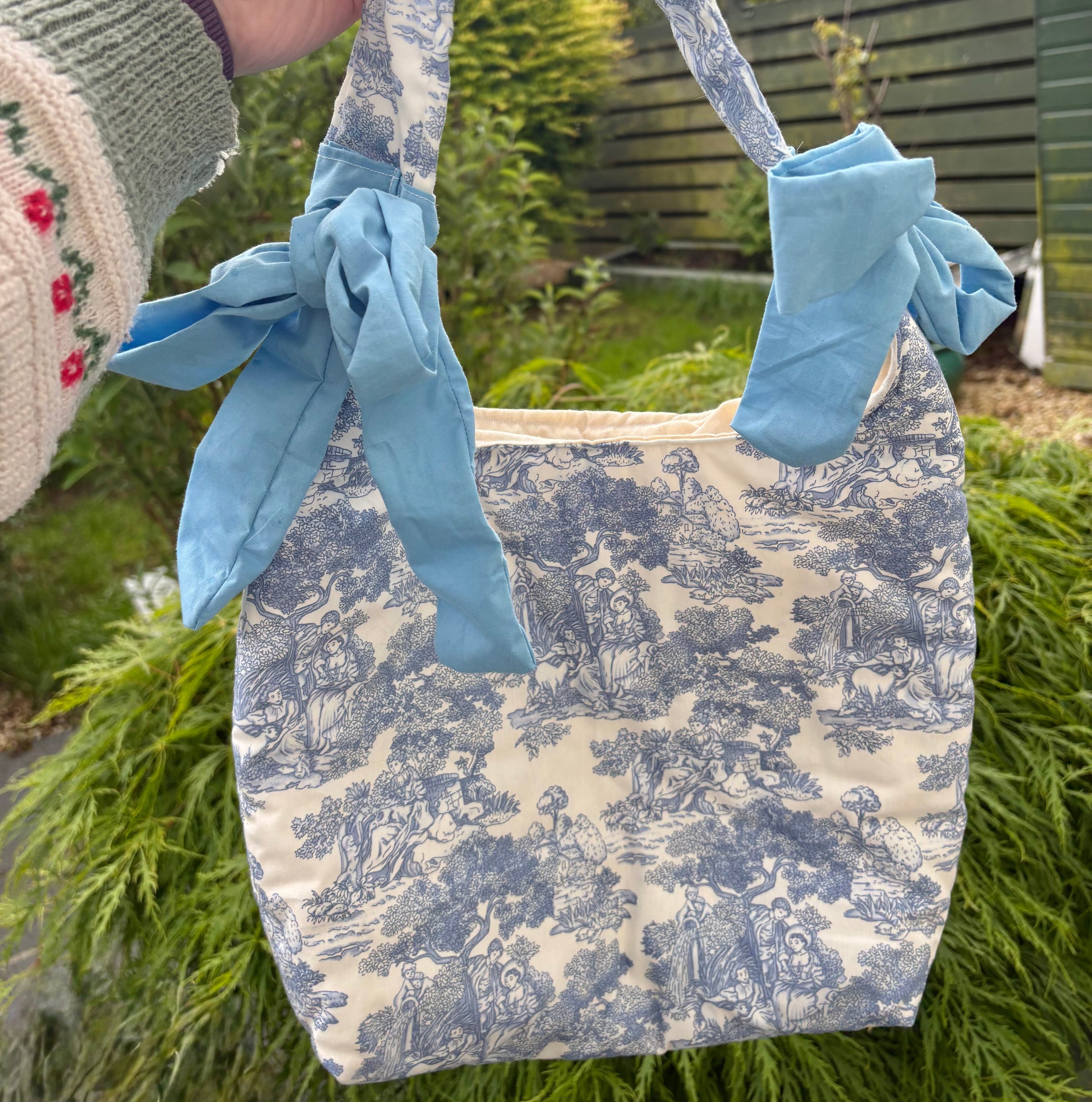 Handmade white and blue porcelain coquette farm print padded tote bag with blue bows