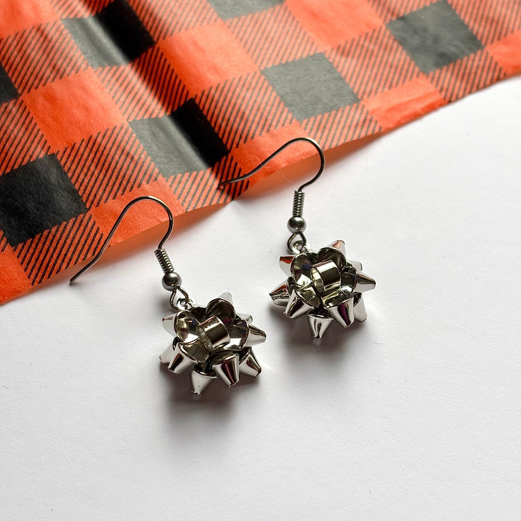 Colourful dangle Christmas fun quirky present bow earrings