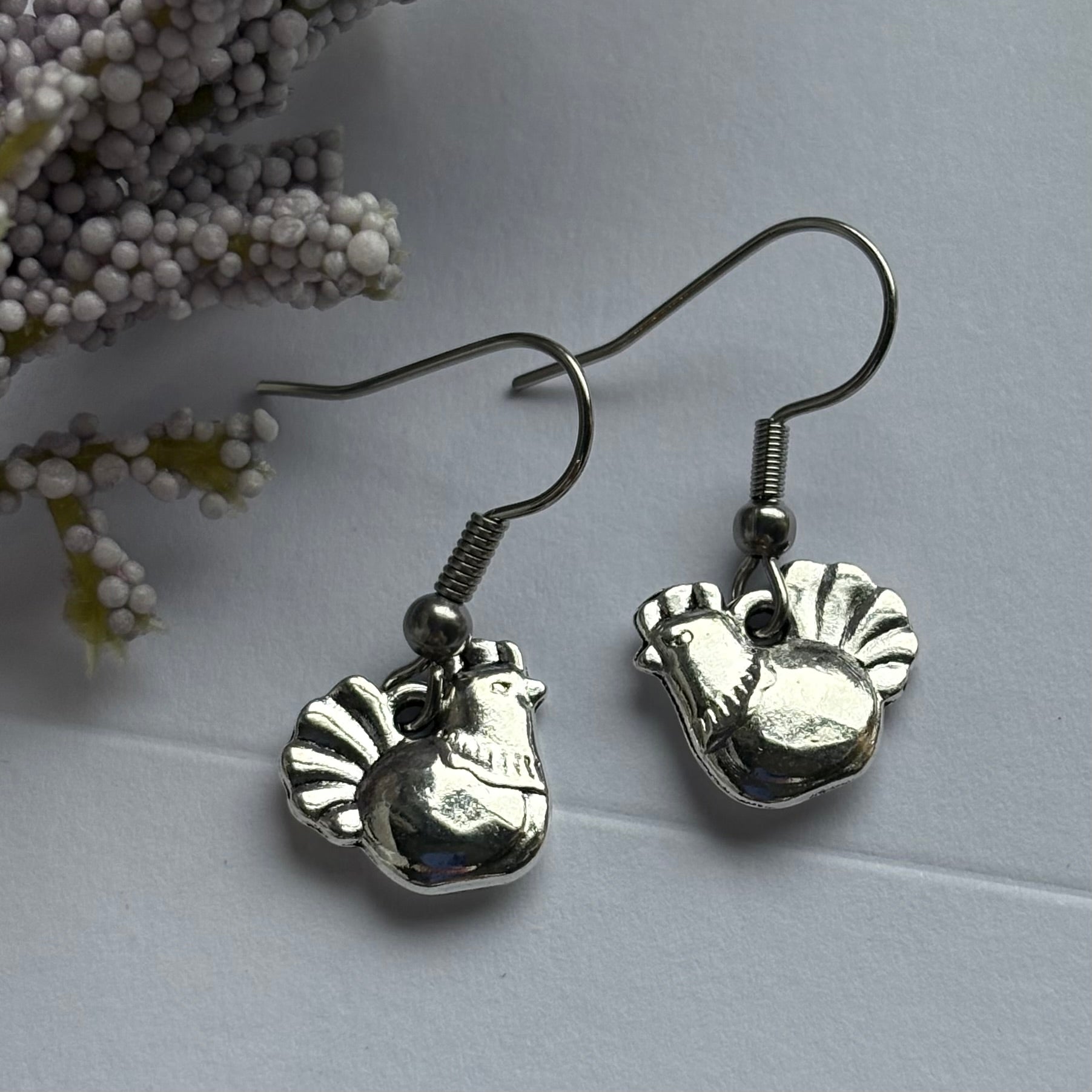 Silver chicken earrings on hypoallergenic hooks