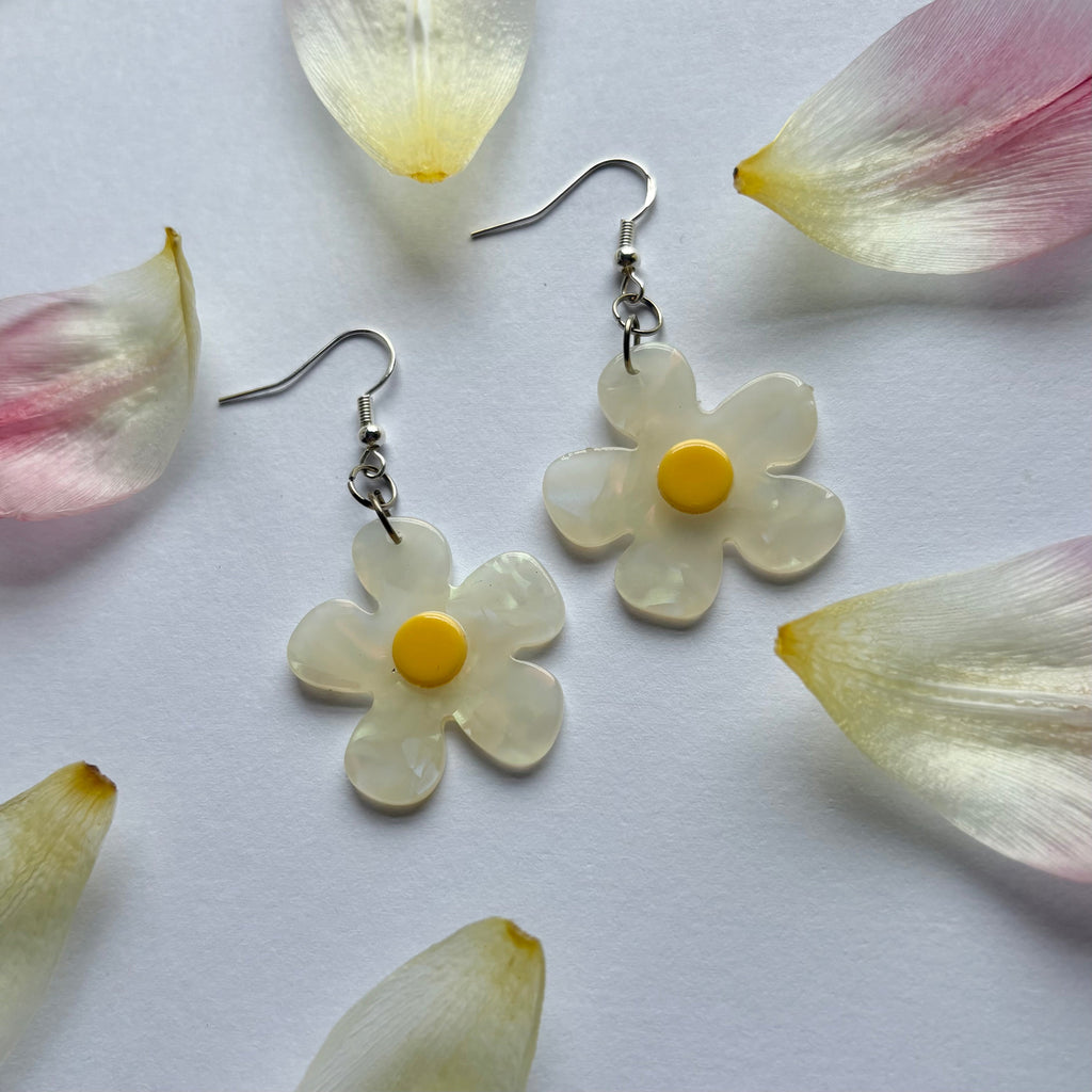 White and yellow or purple opaque flower earrings