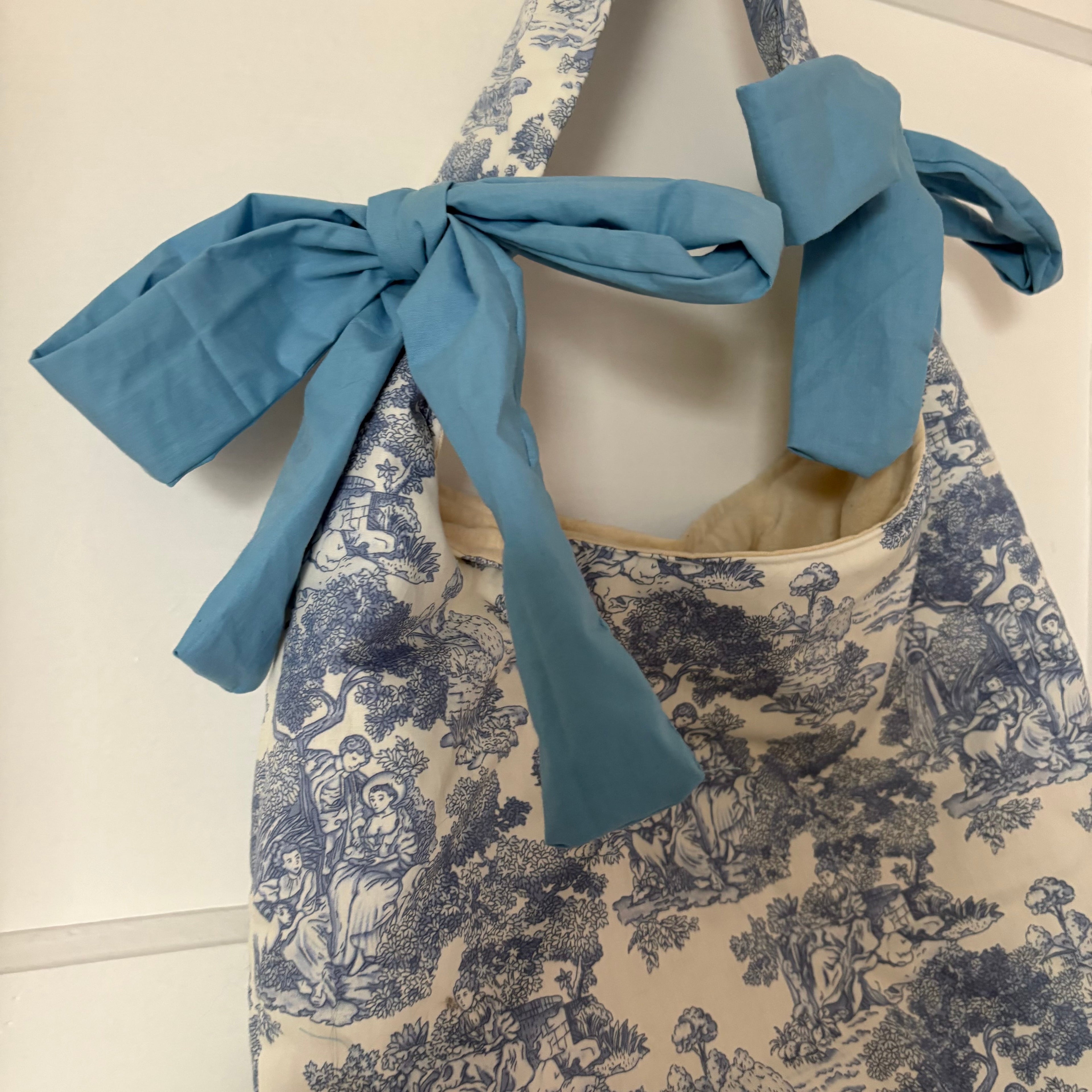 Handmade white and blue porcelain coquette farm print padded tote bag with blue bows