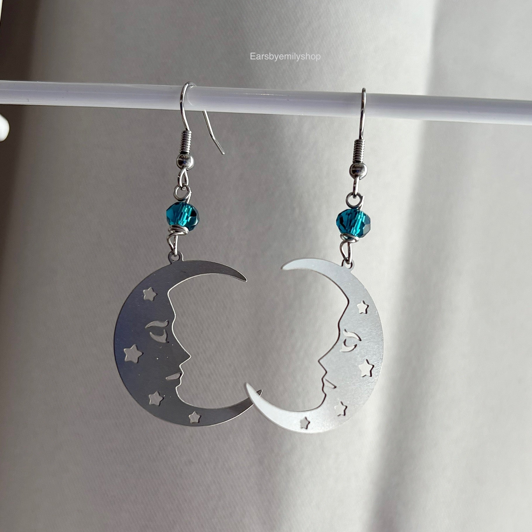 Stainless steel silver statement moon face earrings with blue beads