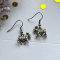 Silver goat earrings on hypoallergenic hooks