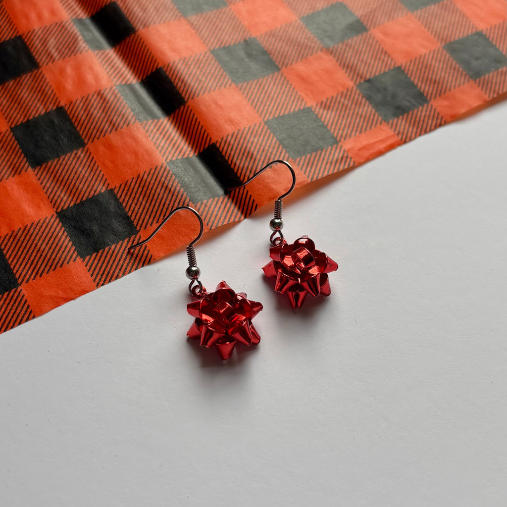 Colourful dangle Christmas fun quirky present bow earrings