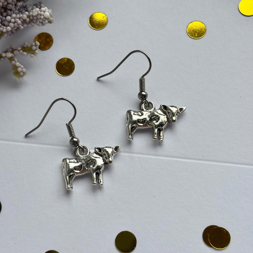 Silver cow earrings on hypoallergenic hooks