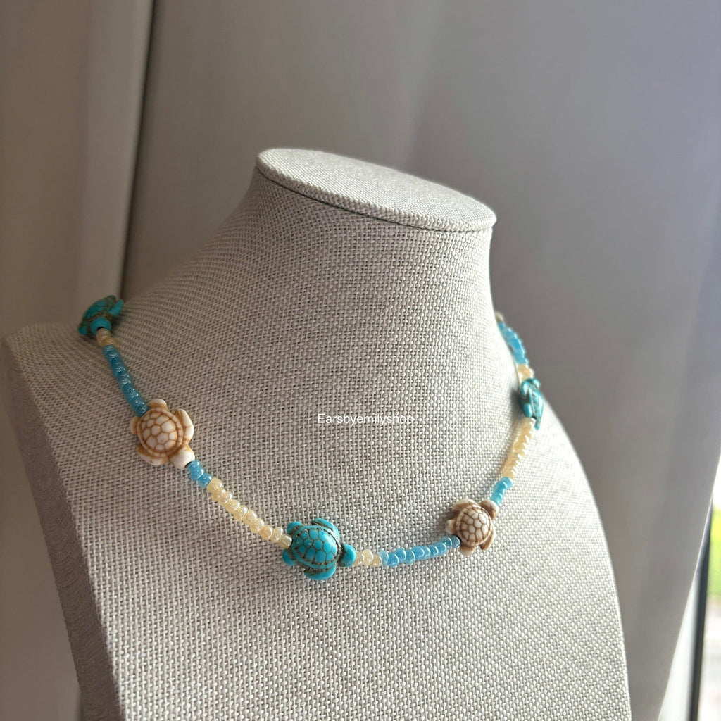 Cool quirky handmade blue and cream beaded beach ocean turtle necklace