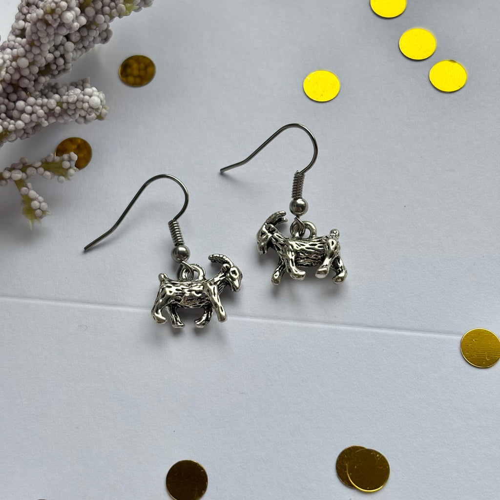 Silver goat earrings on hypoallergenic hooks