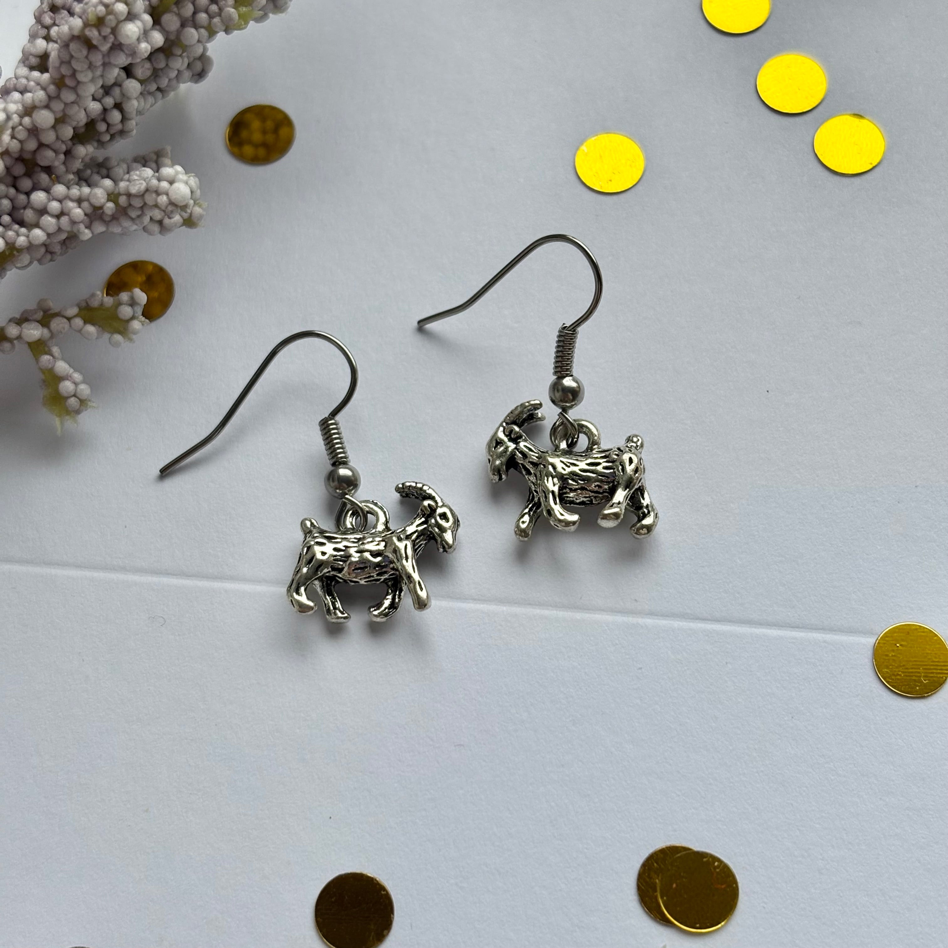 Silver goat earrings on hypoallergenic hooks