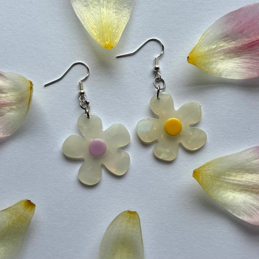 White and yellow or purple opaque flower earrings