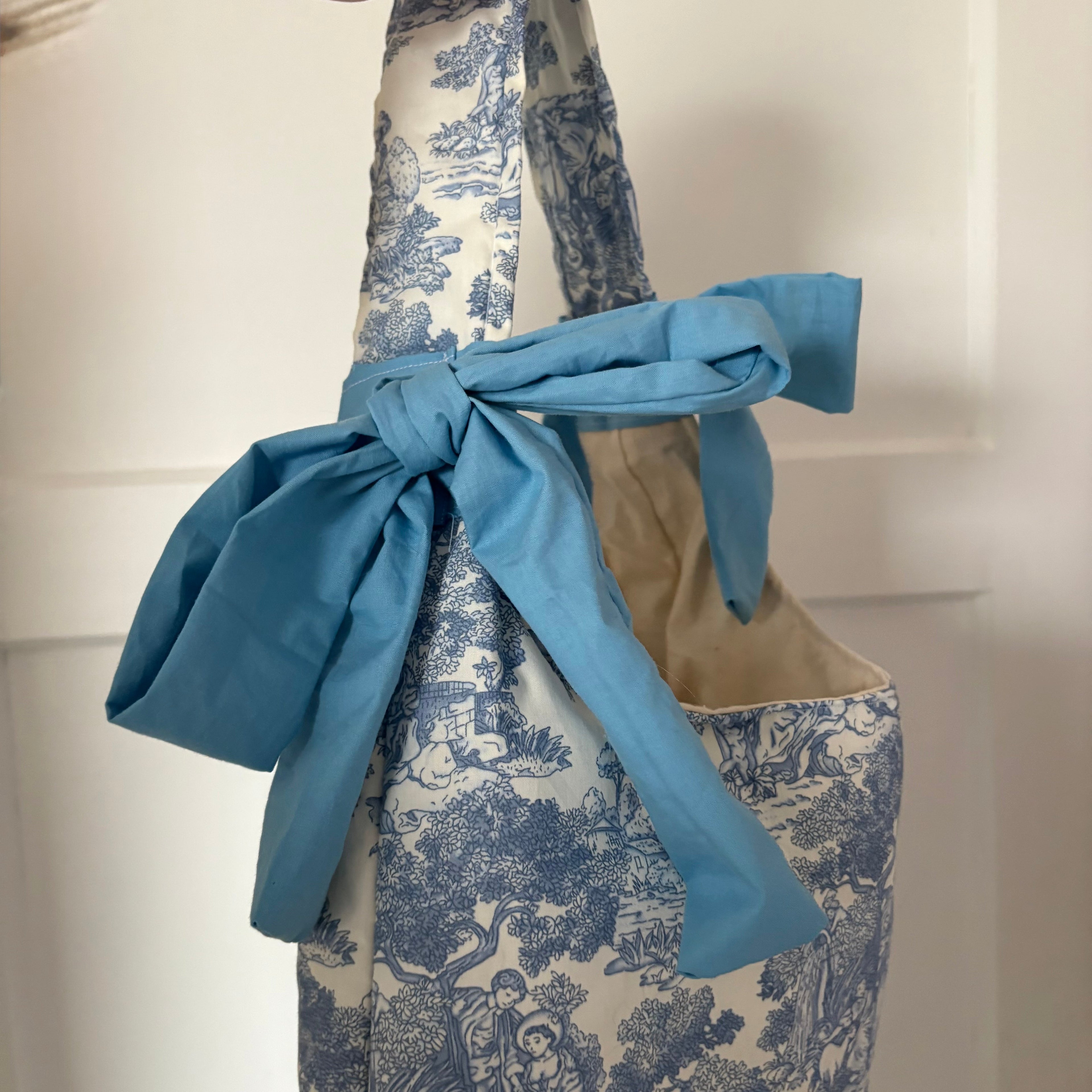 Handmade white and blue porcelain coquette farm print padded tote bag with blue bows