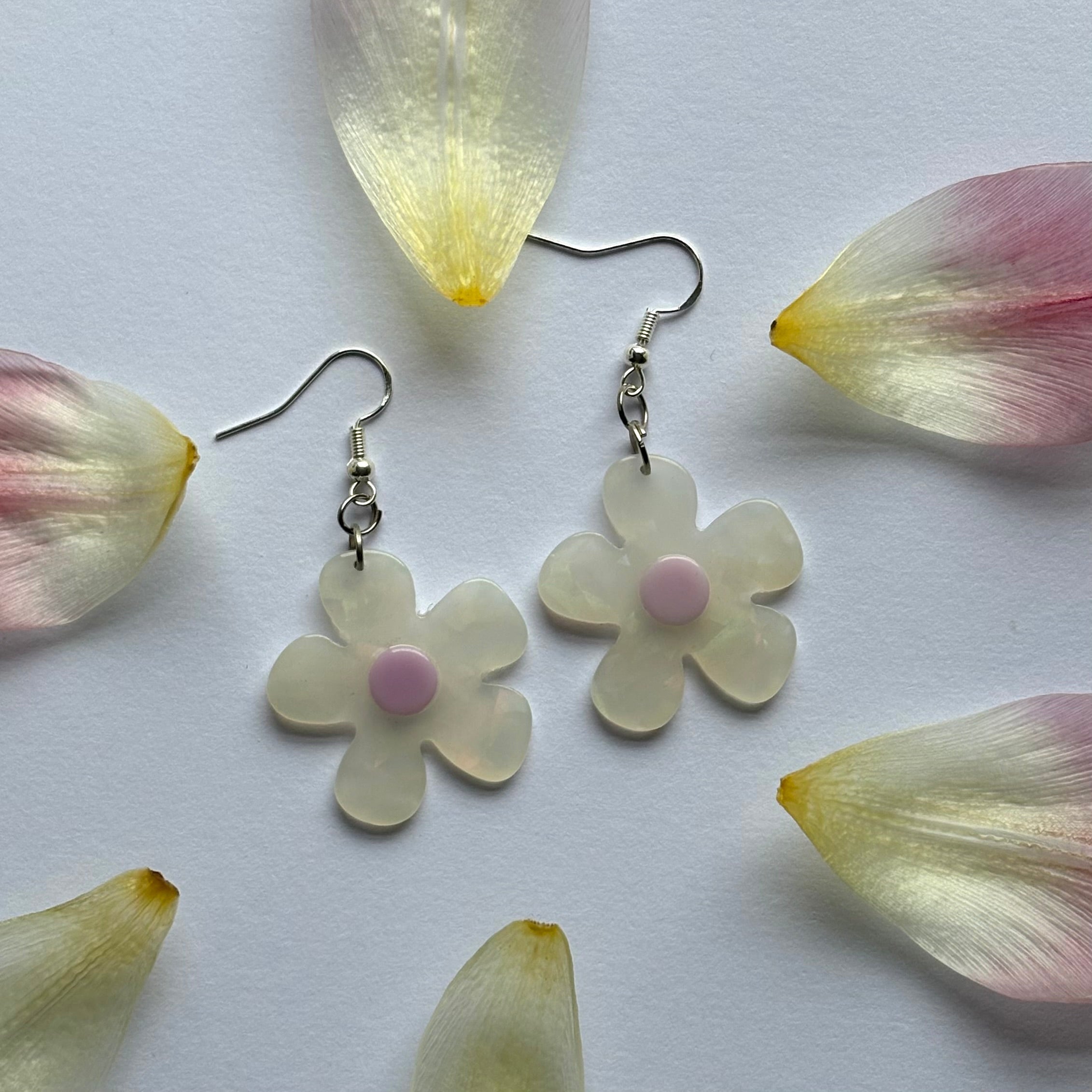 White and yellow or purple opaque flower earrings