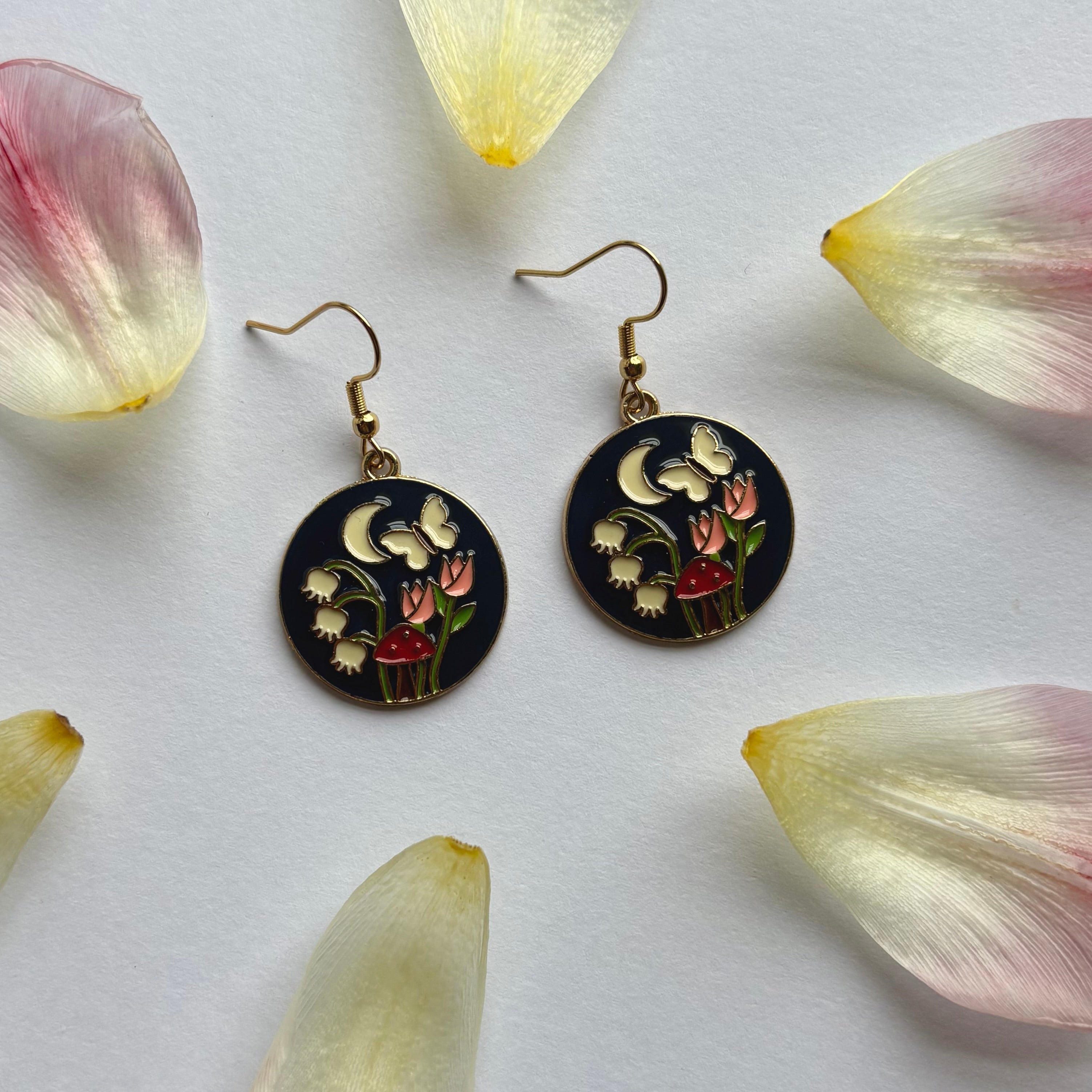 Navy blue circle with flowers and butterfly gold earrings