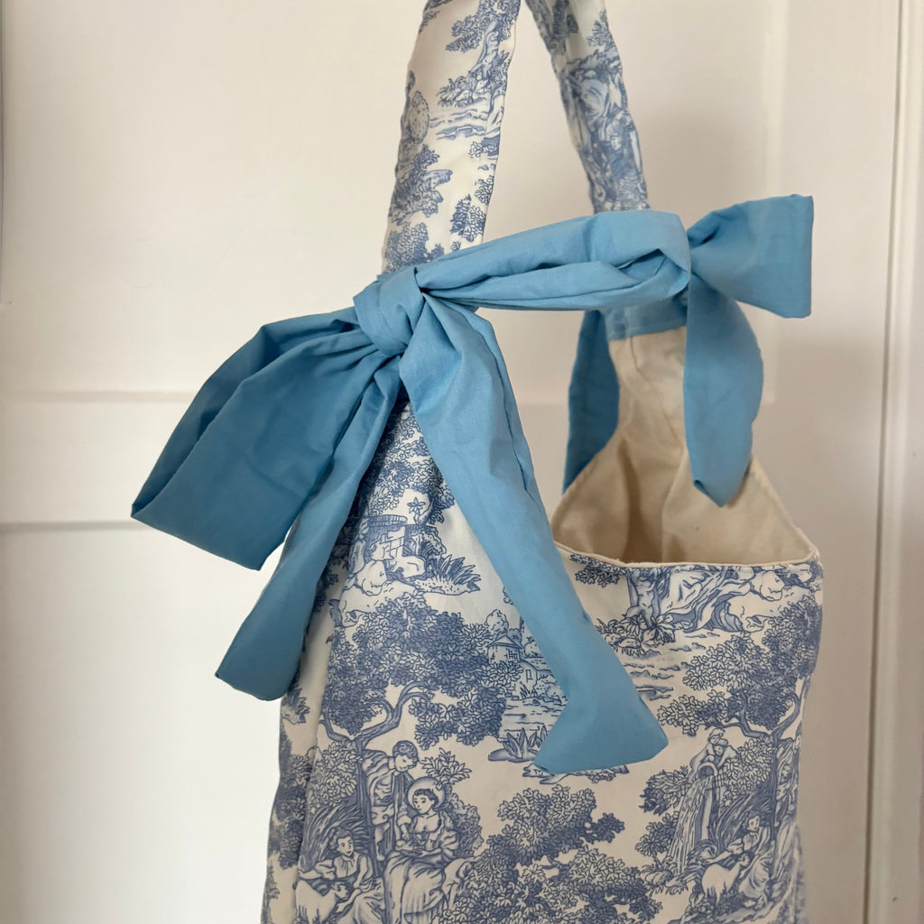 Handmade white and blue porcelain coquette farm print padded tote bag with blue bows