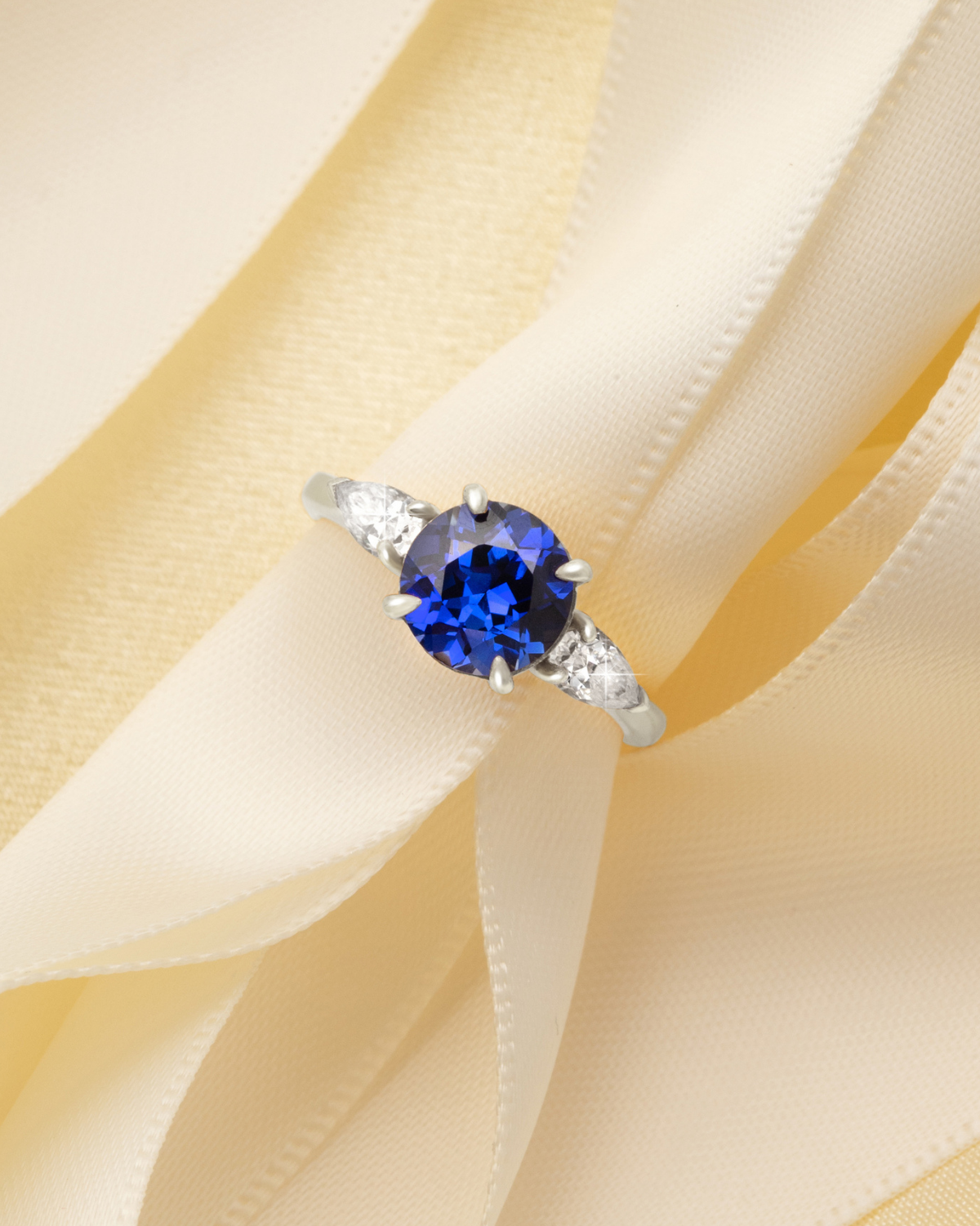 Blue Sapphire Round Cut Three Stone Engagement Ring in Sterling Silver