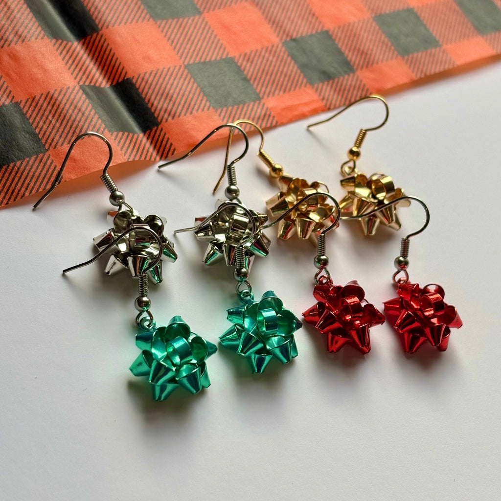 Colourful dangle Christmas fun quirky present bow earrings