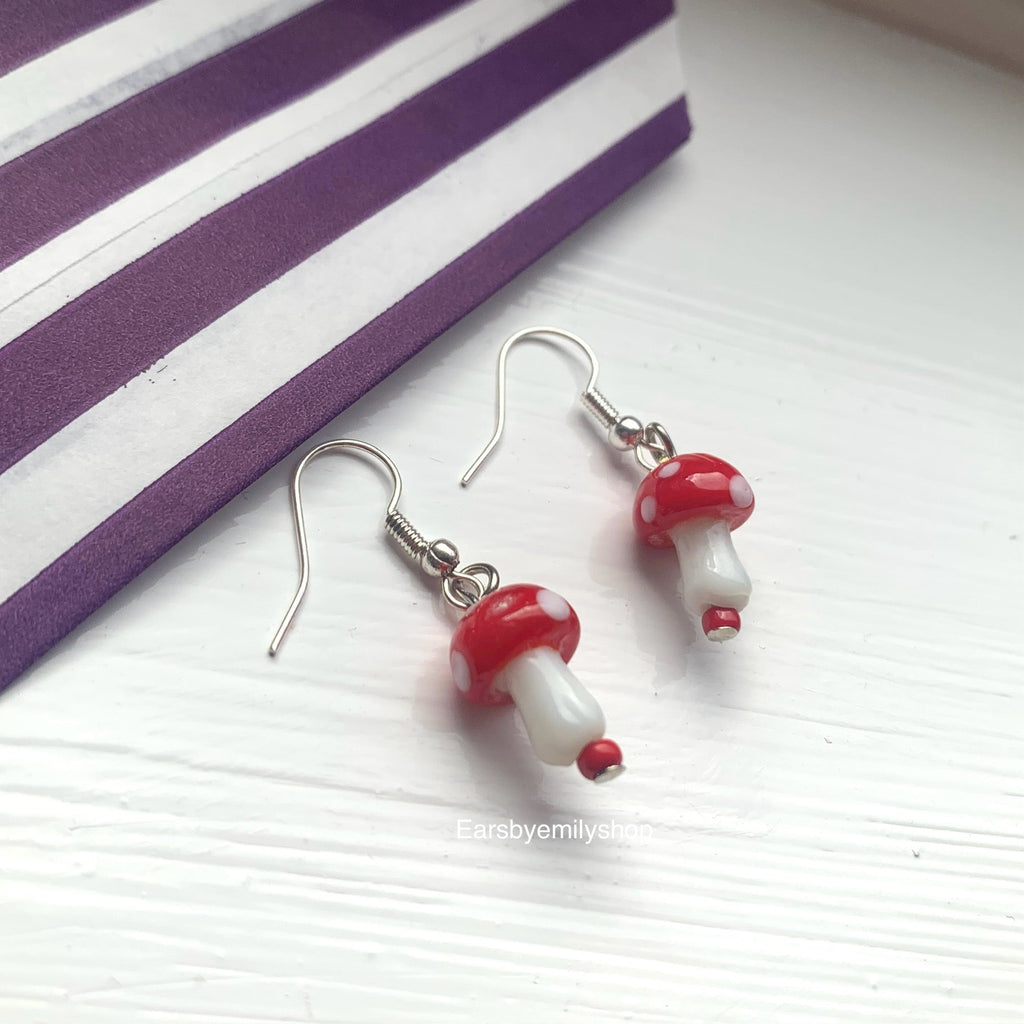 Cool quirky red and white glass mushroom lamp work drop dangle earrings on silver plated hooks.