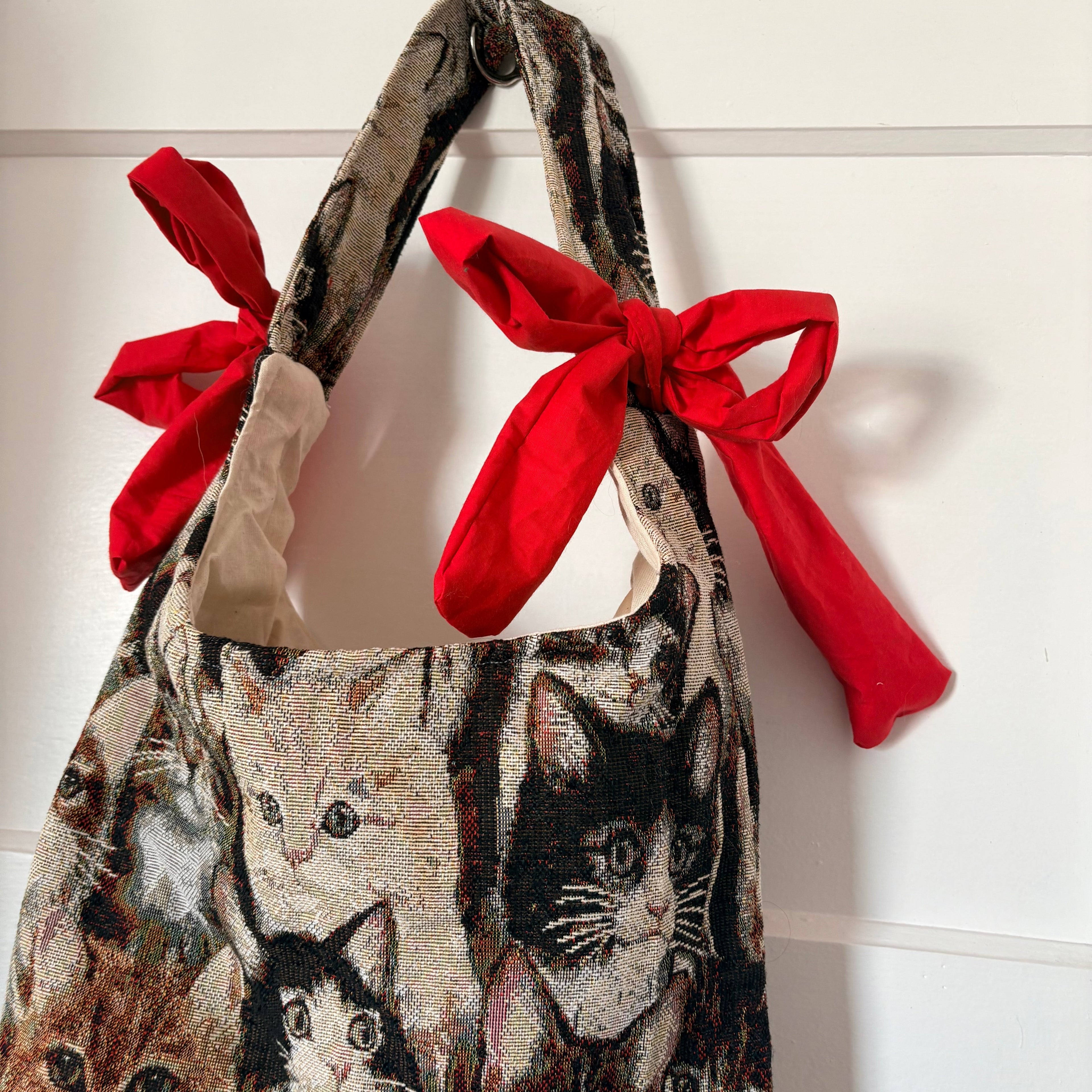 Handmade cool cat tapestry with red bow tote bag