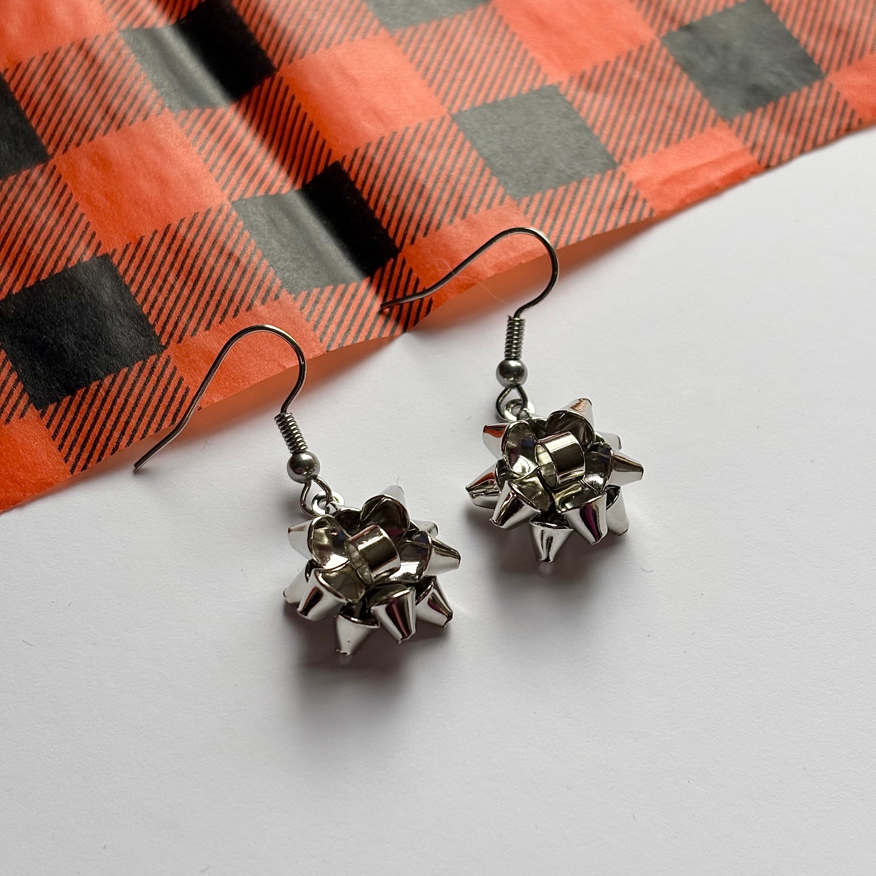 Colourful dangle Christmas fun quirky present bow earrings