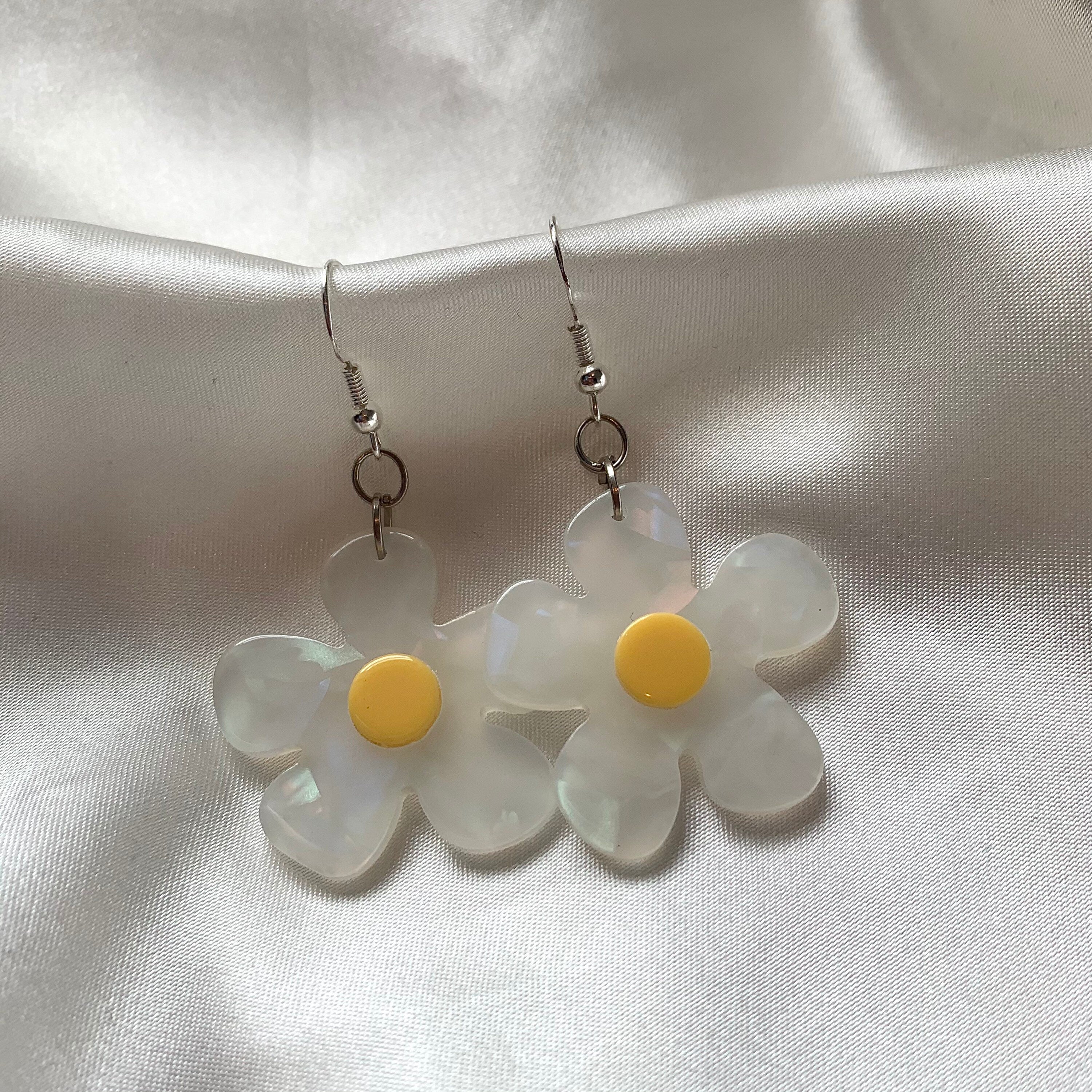 White and yellow or purple opaque flower earrings