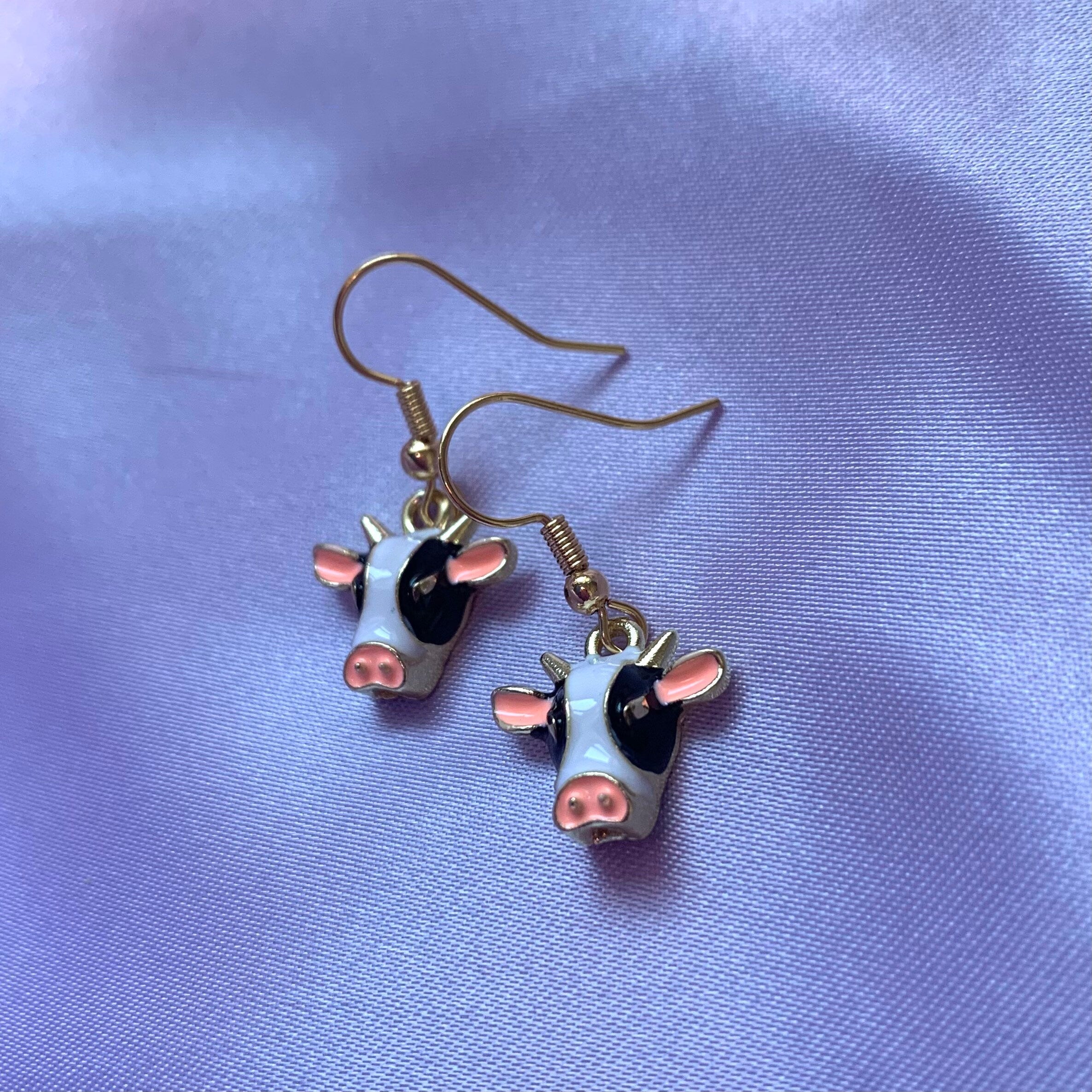 Black and white enamel cow gold earrings