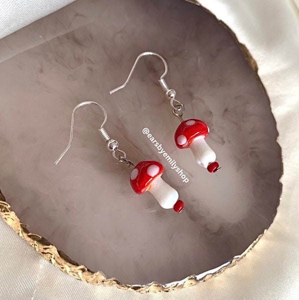 Cool quirky red and white glass mushroom lamp work drop dangle earrings on silver plated hooks.