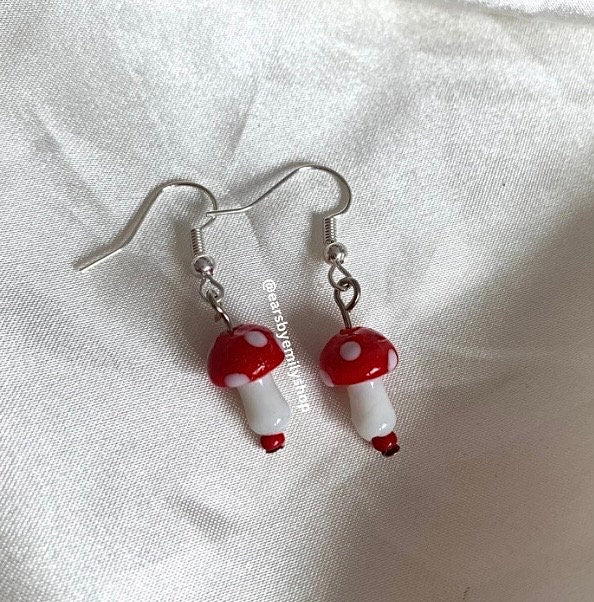 Cool quirky red and white glass mushroom lamp work drop dangle earrings on silver plated hooks.