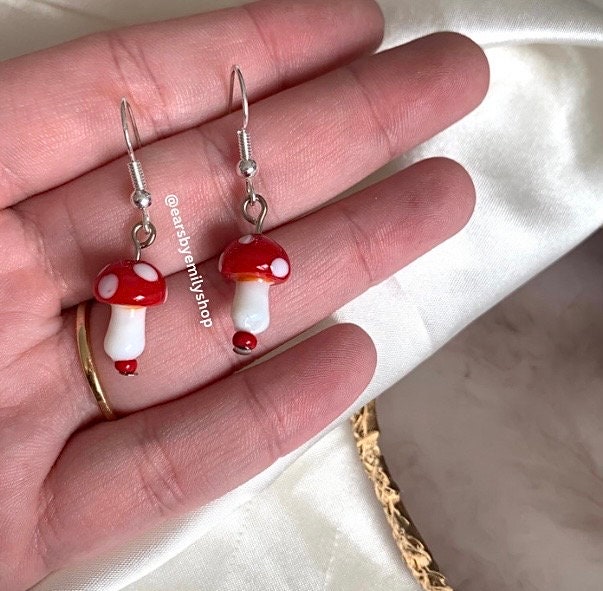 Cool quirky red and white glass mushroom lamp work drop dangle earrings on silver plated hooks.